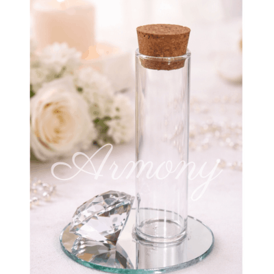 tube à dragées en verre avec bouchon liège sur miroir décoration mariage